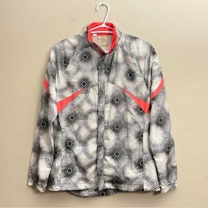 Saucony Black & White Swirl Running Jacket with Vibrant Coral Accents
